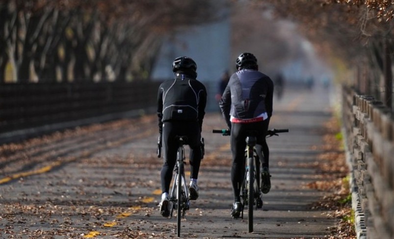 Two people biking during daytime