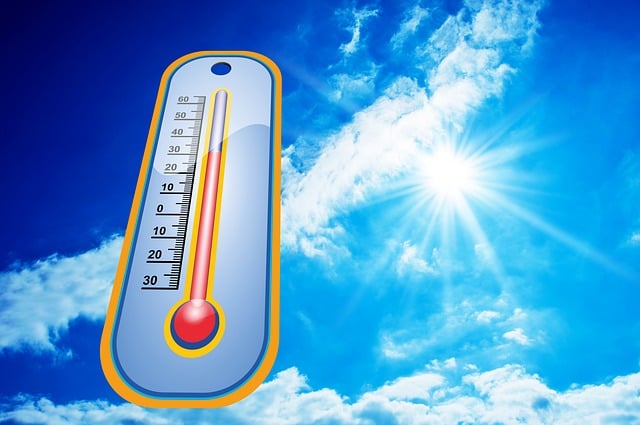 Thermometer against a blue sky  